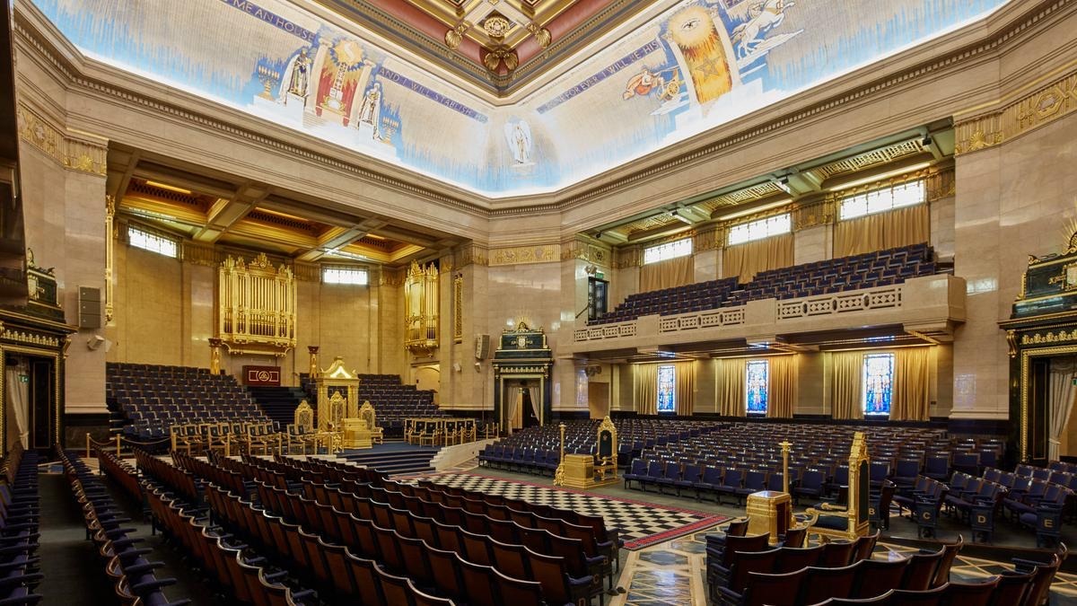 Wide view of the Grand Temple at Freemasons’ Hall, showing its mosaic ceiling, galleries and chequered floor